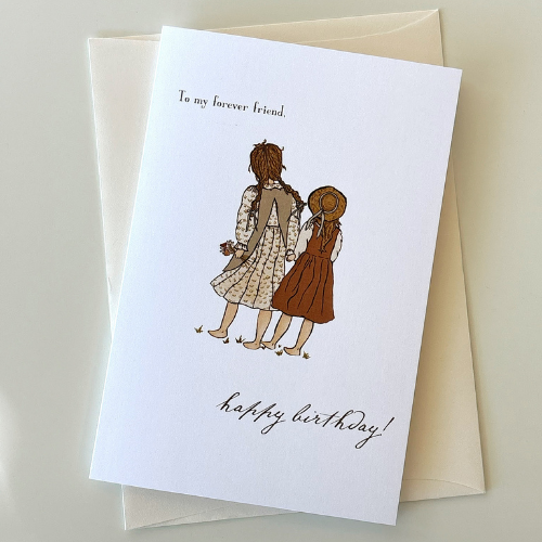 Card with a pic of 2 girls walking together
