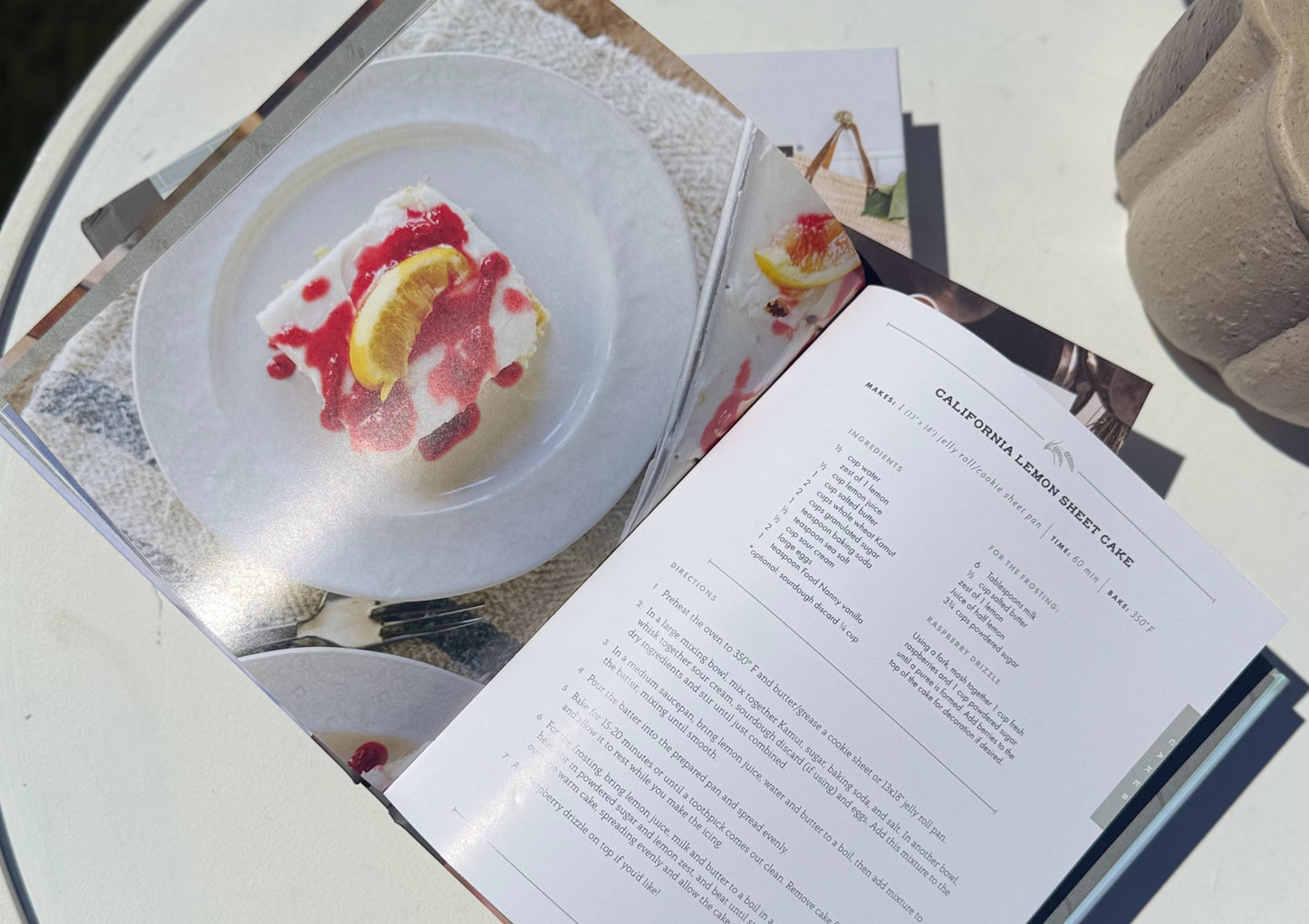 Dessert on a plate with a menu open to a recipe for California Lemon Sherbet Cake.